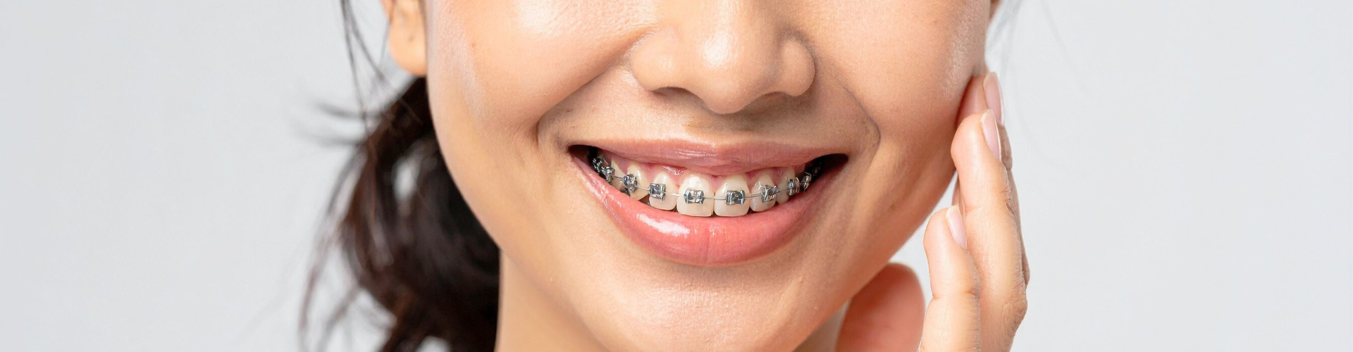 Smiling girl with braces.